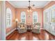 Relaxing sitting area with hardwood floors and French doors at 3341 Gulf Blvd, Belleair Beach, FL 33786