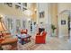 Bright and airy living room with high ceilings, fireplace and hardwood floors at 3341 Gulf Blvd, Belleair Beach, FL 33786