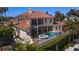 Luxury two-story home with tile roof and private pool at 3341 Gulf Blvd, Belleair Beach, FL 33786
