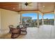 Covered balcony with seating area and ocean view at 3341 Gulf Blvd, Belleair Beach, FL 33786