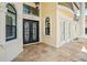 Elegant entryway with a double door and ornate ironwork at 3341 Gulf Blvd, Belleair Beach, FL 33786