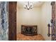 Elegant wine cellar features a stone wall and custom-built cabinetry at 3341 Gulf Blvd, Belleair Beach, FL 33786