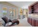 Relaxing sitting area with French doors leading to balcony at 3341 Gulf Blvd, Belleair Beach, FL 33786
