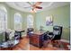 Home office with hardwood floors and built-in bookcase at 3341 Gulf Blvd, Belleair Beach, FL 33786