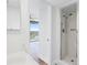 Clean bathroom with shower and view of bedroom and balcony at 500 N Osceola Ave # 802, Clearwater, FL 33755