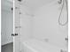 Clean bathroom featuring a shower/tub combo and white tile at 500 N Osceola Ave # 802, Clearwater, FL 33755