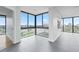 Bright living room with large windows offering scenic views at 500 N Osceola Ave # 802, Clearwater, FL 33755