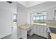 Modern kitchen with white cabinets, stainless steel appliances, and tile flooring at 500 N Osceola Ave # 802, Clearwater, FL 33755