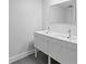 Modern bathroom with double vanity and dark gray floor tiles at 500 N Osceola Ave # 802, Clearwater, FL 33755