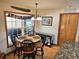 Cozy breakfast nook with round table and four chairs, adjacent to kitchen at 26240 Willow St, Brooksville, FL 34601