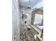 Walk-in shower with pebble floor and stone tile at 26240 Willow St, Brooksville, FL 34601