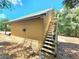 Detached workshop with exterior stairs and a metal roof at 26240 Willow St, Brooksville, FL 34601