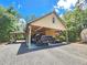 Covered carport with ample space for vehicles and storage at 26240 Willow St, Brooksville, FL 34601