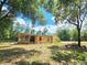 Spacious house nestled on a large lot with mature trees at 26240 Willow St, Brooksville, FL 34601