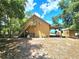 Detached workshop with a second-story loft and exterior stairs at 26240 Willow St, Brooksville, FL 34601