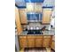 Kitchen boasting granite countertops, oak cabinets, and a built-in microwave at 26240 Willow St, Brooksville, FL 34601