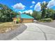 Spacious two-car garage with stone accents and a metal roof at 26240 Willow St, Brooksville, FL 34601
