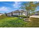 Side view showcasing the home's exterior and landscaping at 13285 Crest Lake Dr, Hudson, FL 34669