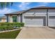 Two-car garage and well manicured landscaping at 13285 Crest Lake Dr, Hudson, FL 34669