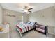 Cozy bedroom with a full-sized bed and crib at 13285 Crest Lake Dr, Hudson, FL 34669