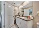 Bathroom with double vanity and granite countertop at 13285 Crest Lake Dr, Hudson, FL 34669