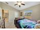 Bedroom with a view, full-sized bed, and access to bathroom at 13285 Crest Lake Dr, Hudson, FL 34669