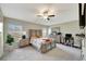 Main bedroom with a comfortable bed and plenty of natural light at 13285 Crest Lake Dr, Hudson, FL 34669
