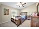 Spacious bedroom with a wooden bed frame and plenty of natural light at 13285 Crest Lake Dr, Hudson, FL 34669