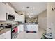 Modern kitchen with stainless steel appliances and granite counters at 13285 Crest Lake Dr, Hudson, FL 34669