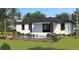 Single-story home with a private pool, deck, and lush tropical landscaping at 4026 Yucatan Cir, Port Charlotte, FL 33948