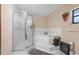 Bathroom with shower, tub, and linen rack at 8067 Tranquil Dr, Spring Hill, FL 34606