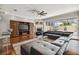 Spacious living room featuring a large sectional sofa and hardwood floors at 348 Larboard Way, Clearwater, FL 33767