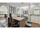 Home office with view into kitchen, hardwood floors, and modern decor at 348 Larboard Way, Clearwater, FL 33767