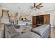 Open living space with sectional sofa, hardwood floors, and fireplace at 348 Larboard Way, Clearwater, FL 33767