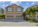 Two-story townhouse with a two-car garage and paver driveway at 348 Larboard Way, Clearwater, FL 33767