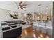 Living area with hardwood floors, sectional sofa and kitchen island at 348 Larboard Way, Clearwater, FL 33767