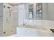 Bathroom with walk-in shower and soaking tub at 348 Larboard Way, Clearwater, FL 33767
