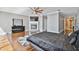 Large main bedroom with hardwood floors, a fireplace, and a ceiling fan at 348 Larboard Way, Clearwater, FL 33767
