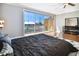 Main bedroom with water views and sliding glass doors to balcony at 348 Larboard Way, Clearwater, FL 33767