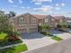 Luxury townhouses with attached garages and lush landscaping at 348 Larboard Way, Clearwater, FL 33767