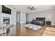 Main bedroom with hardwood floors, fireplace, and ceiling fan at 348 Larboard Way, Clearwater, FL 33767