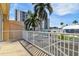 Balcony overlooking a courtyard with partial water view at 348 Larboard Way, Clearwater, FL 33767