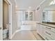 Elegant bathroom with double vanity, soaking tub, and a walk-in shower at 348 Larboard Way, Clearwater, FL 33767