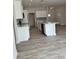 White kitchen with island and stainless steel appliances at 37570 Teri Ct, Dade City, FL 33525