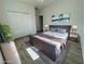 Guest bedroom with double door closet and wood flooring at 37570 Teri Ct, Dade City, FL 33525