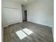 Bright bedroom with double doors closet and wood-look flooring at 37570 Teri Ct, Dade City, FL 33525
