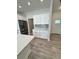 White kitchen cabinets and quartz countertops with a view of the dining area at 37570 Teri Ct, Dade City, FL 33525