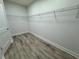 Spacious walk-in closet with wood-look floors at 37570 Teri Ct, Dade City, FL 33525