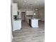 Spacious kitchen with white cabinets, stainless steel appliances, and quartz countertops at 37570 Teri Ct, Dade City, FL 33525