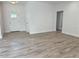 Bright and airy living room with wood-look flooring at 37570 Teri Ct, Dade City, FL 33525